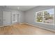 Bright bedroom with light hardwood floors and large window at 2724 Oxford St, Orlando, FL 32803