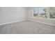 Well-lit bedroom with gray carpet and large window at 2724 Oxford St, Orlando, FL 32803