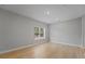 Spacious bedroom with large window and light wood flooring at 2724 Oxford St, Orlando, FL 32803