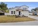Two-story house with white siding, blue door, and landscaped yard at 2724 Oxford St, Orlando, FL 32803
