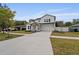 Two-story house with white siding, blue door, and landscaped yard at 2724 Oxford St, Orlando, FL 32803
