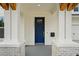 Modern blue front door with stone and wood accents at 2724 Oxford St, Orlando, FL 32803