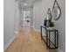 Light and airy hallway with light wood floors at 2724 Oxford St, Orlando, FL 32803