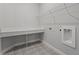 Convenient laundry room with built-in counter and patterned flooring at 2724 Oxford St, Orlando, FL 32803