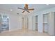 Spacious bedroom with ceiling fan, large closets and adjacent bathroom at 2771 Park Ave, Indian Lake Estates, FL 33855