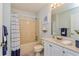 Standard bathroom with a shower-tub combo, neutral color scheme, and functional vanity at 3445 Roanoke St, The Villages, FL 32162