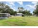 House with large backyard and surrounding trees at 323 Nw 25Th St, Ocala, FL 34475