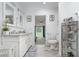 Elegant bathroom with double sinks and access to bedroom at 323 Nw 25Th St, Ocala, FL 34475