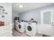 Bright laundry room with washer, dryer, and storage at 323 Nw 25Th St, Ocala, FL 34475