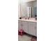 Bathroom with single vanity, white cabinets and a pink stool at 1455 Viscaya Cove Blvd, Winter Garden, FL 34787