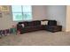 Spacious living room with grey sectional sofa and plush carpet at 1455 Viscaya Cove Blvd, Winter Garden, FL 34787