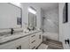 Bathroom features double sinks, granite countertops, matte black fixtures, and decorative white marble-style tiling at 225 Diesel Rd, Mulberry, FL 33860