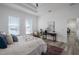 Bright bedroom with water views, plush bedding, and a sitting area at 225 Diesel Rd, Mulberry, FL 33860