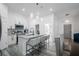 Open-concept kitchen with a granite island, stainless steel appliances, and a breakfast bar at 225 Diesel Rd, Mulberry, FL 33860