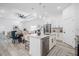 Open-concept kitchen with a granite island, stainless steel appliances, and a breakfast bar at 225 Diesel Rd, Mulberry, FL 33860