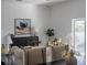 Inviting living room showcases a cabinet, painting, decorative plants, and comfortable seating arrangement at 225 Diesel Rd, Mulberry, FL 33860