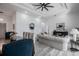 Open-concept living space with a dining area and sofa, perfect for modern living and entertaining guests at 225 Diesel Rd, Mulberry, FL 33860