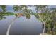 A serene water view showcases tree lined banks and calm water, emphasizing the tranquility of the area at 225 Diesel Rd, Mulberry, FL 33860