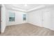 Bright bedroom with carpeted floor and neutral walls at 3728 Bergamot St, Lake Alfred, FL 33850