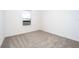 Simple bedroom with carpeted floor and a window at 3728 Bergamot St, Lake Alfred, FL 33850