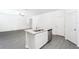 Kitchen island with granite countertop and stainless steel dishwasher at 3728 Bergamot St, Lake Alfred, FL 33850