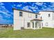 Two story house with covered patio and grassy backyard at 3740 Bergamot St, Lake Alfred, FL 33850