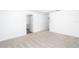 Spacious bedroom with carpet and access to bathroom and closet at 3740 Bergamot St, Lake Alfred, FL 33850