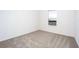 Simple bedroom with neutral wall paint and carpeted floor at 3740 Bergamot St, Lake Alfred, FL 33850