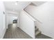 Open entryway with grey wood-look floors and staircase to second floor at 3740 Bergamot St, Lake Alfred, FL 33850