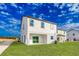 Two-story home with backyard, patio, and landscaping at 3744 Bergamot St, Lake Alfred, FL 33850
