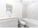 Clean bathroom with white vanity, toilet, and bathtub at 3732 Bergamot St, Lake Alfred, FL 33850