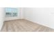 Bright bedroom featuring neutral carpeting and a window with blinds at 3732 Bergamot St, Lake Alfred, FL 33850