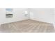 Bright bedroom with neutral carpeting and large windows at 3732 Bergamot St, Lake Alfred, FL 33850