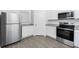 Stainless steel appliances and white cabinets highlight this kitchen at 3732 Bergamot St, Lake Alfred, FL 33850