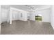 Open living area with vinyl flooring and sliding glass doors at 3732 Bergamot St, Lake Alfred, FL 33850