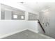 Upper level hallway with carpet and views into other rooms at 7126 Regina Way, Orlando, FL 32819