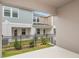 Private backyard with a black fence and views of neighboring townhomes at 4337 Hillock Blvd, Haines City, FL 33844