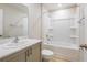 Well-lit bathroom featuring a single sink and shower-tub combo at 4337 Hillock Blvd, Haines City, FL 33844