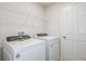 Laundry room equipped with a modern washer and dryer at 4337 Hillock Blvd, Haines City, FL 33844