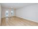 Spacious living room with wood-look floors, leading to an outdoor patio area at 4337 Hillock Blvd, Haines City, FL 33844