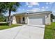 Well-maintained single Gathering home with a clean, bright driveway and manicured lawn at 2511 Avenue E Sw, Winter Haven, FL 33880