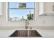 Bright kitchen with a view from the window above the stainless steel sink at 2511 Avenue E Sw, Winter Haven, FL 33880