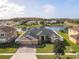 Stunning property overlooking a lake, showcasing a spacious backyard at 4204 Sevan Way, Kissimmee, FL 34746