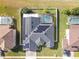 Top-down view of house with solar panels and pool at 4204 Sevan Way, Kissimmee, FL 34746