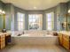 Relaxing bathroom with soaking tub and double vanity at 4204 Sevan Way, Kissimmee, FL 34746