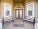 Inviting front porch with double doors and welcoming mat at 4204 Sevan Way, Kissimmee, FL 34746