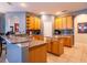 Open kitchen boasts granite countertops and oak cabinets at 4204 Sevan Way, Kissimmee, FL 34746
