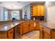 Large kitchen featuring granite countertops and oak cabinets at 4204 Sevan Way, Kissimmee, FL 34746