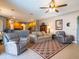 Relaxing living room with neutral color palette and comfy seating at 4204 Sevan Way, Kissimmee, FL 34746