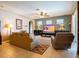 Comfortable living room featuring a large TV and seating area at 4204 Sevan Way, Kissimmee, FL 34746